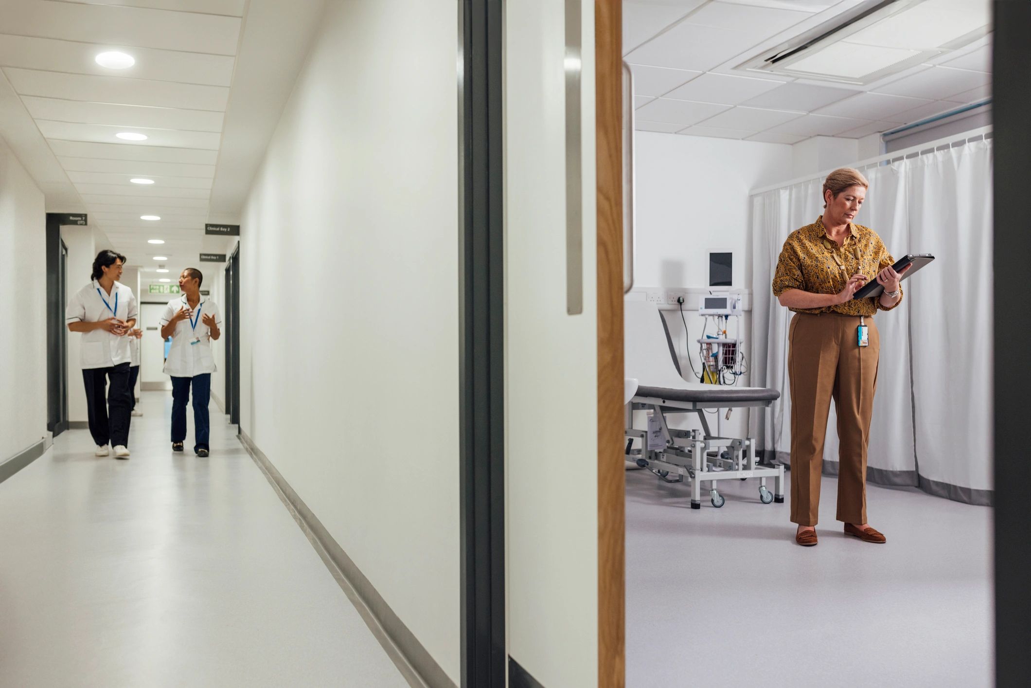 Healthcare professionals in a clinic corridor