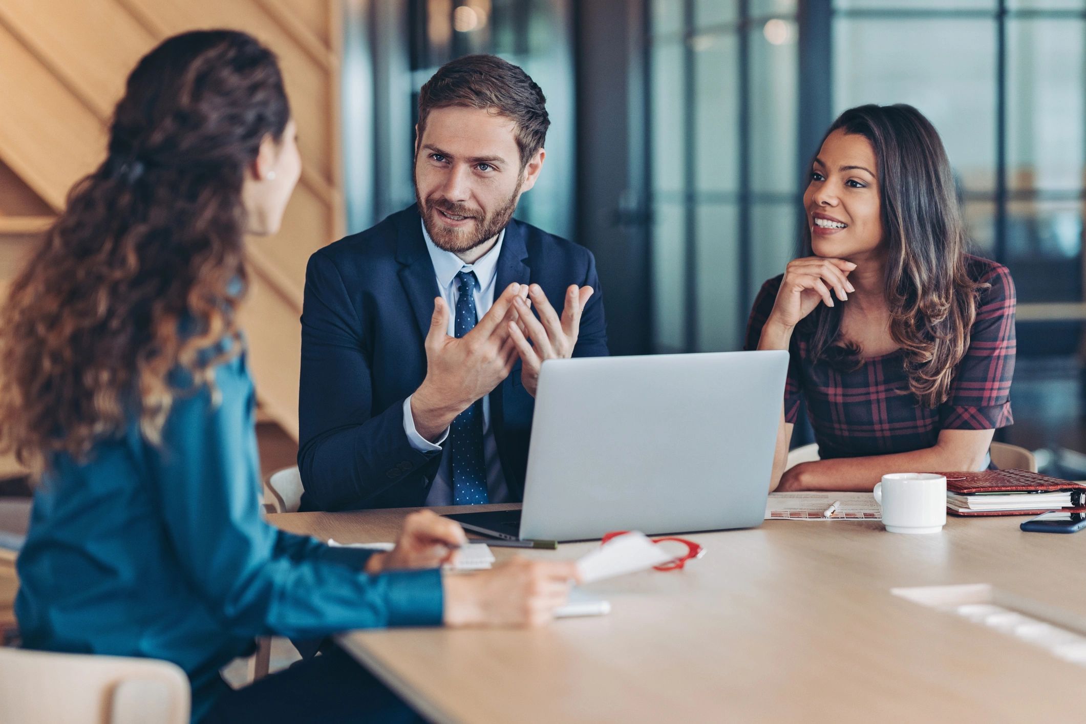 Business professional presenting financial workflow improvements to colleagues