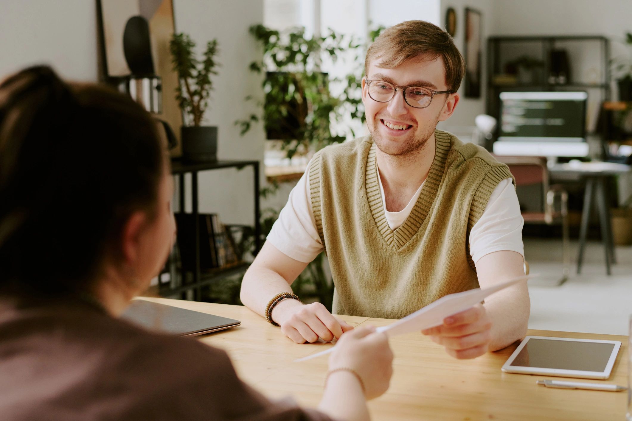 Loan advisor reviewing approval details with client