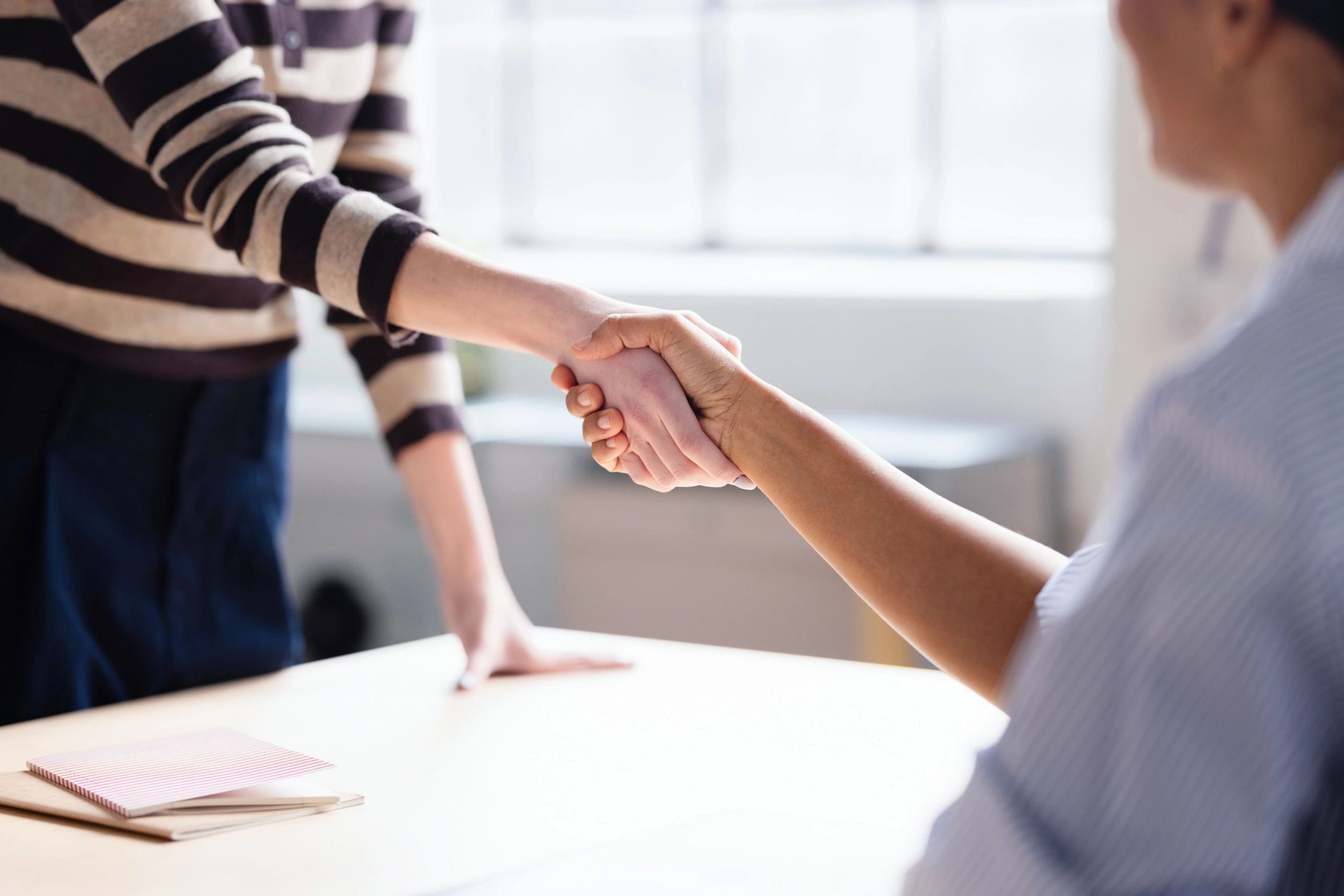 Business handshake in an office meeting